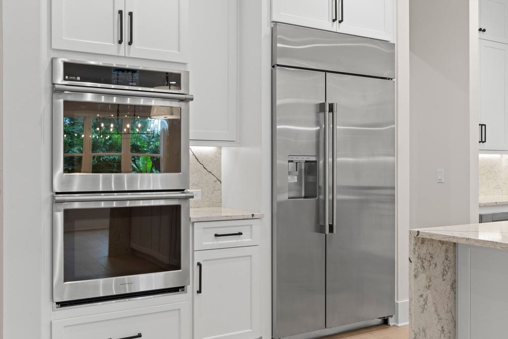 stainless-steel appliances in luxury kitchen - Biarritz Builders
